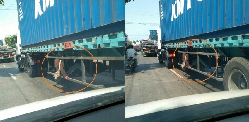 Sosok di bawah truk kontainer ini bikin pengendara lain kaget, udah kaya punya nyawa sembilan selonjoran disana