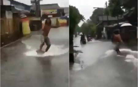 Viral video pria surfing saat banjir, aksinya absurd abis!